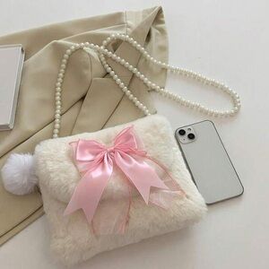 Cute pink and white faux fur bag with pearl strap